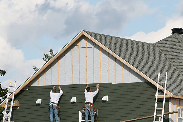 Professional Storm Damage Siding Repair technician working in Hopkinton, MA